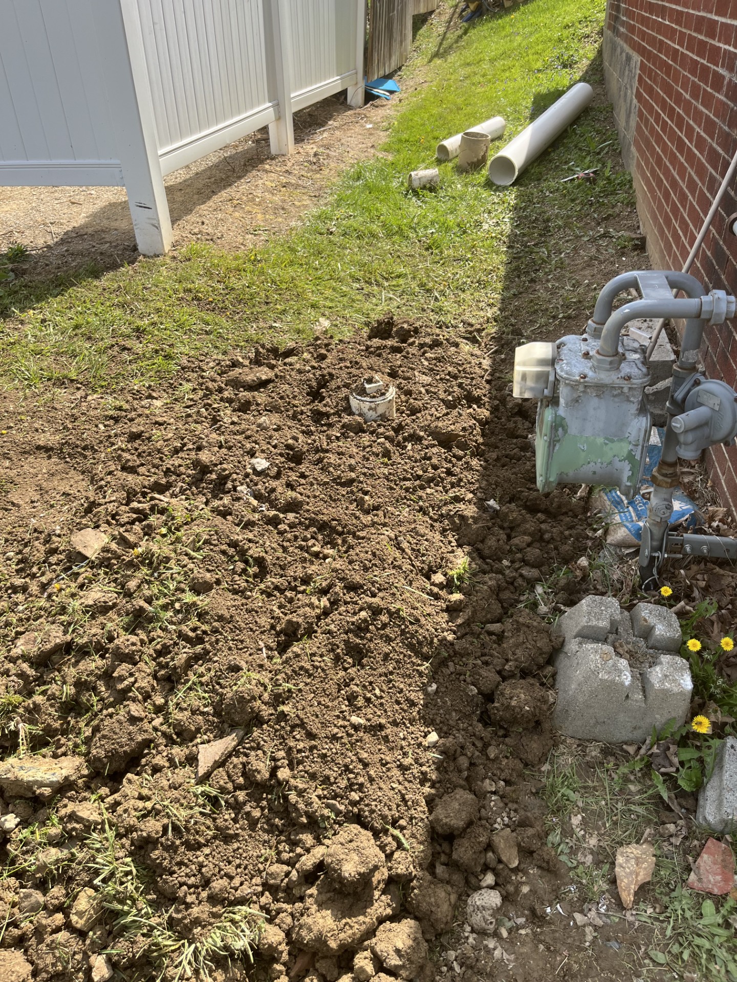 Residential water line excavation beside a Steubenville-area home